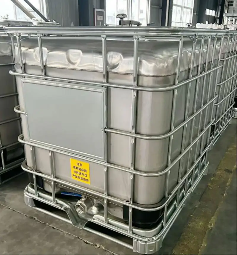 Another stainless steel IBC photographed inside the workshop