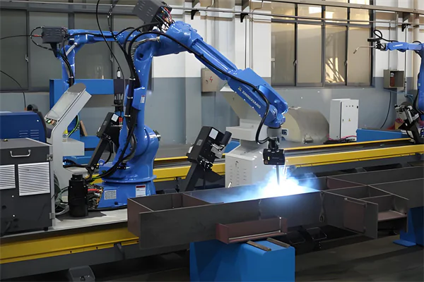 Industrial welding robot working on a metal assembly