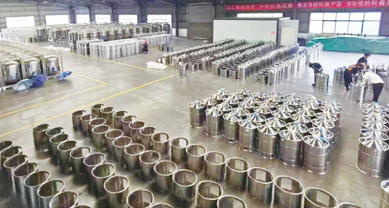 Stainless steel containers arranged on the workshop floor